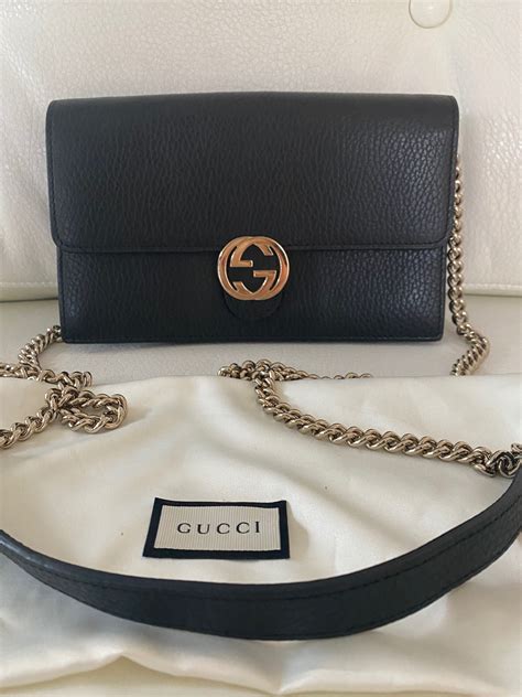 gucci interlocking wallet on chain.